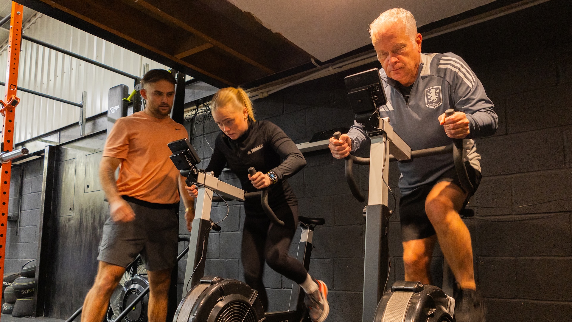 Maisie, Adam and her dad at a workout